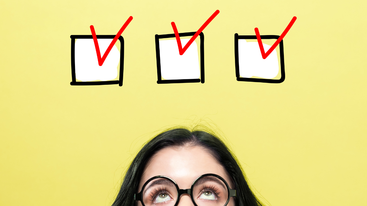 A woman with dark glasses gazes up at 3 checkmarks on a yellow background.