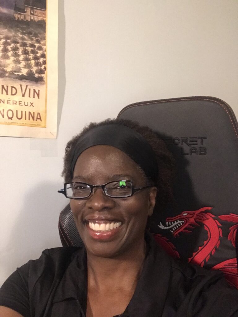 Author Charlene Parris is smiling at the camera.