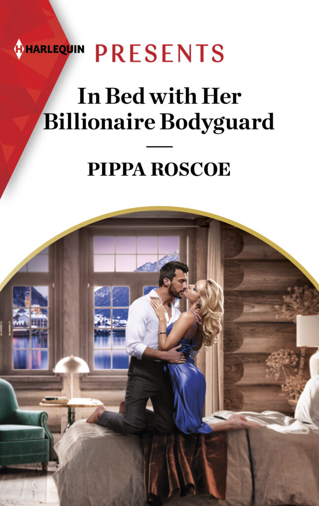 Cover for In Bed with Her Billionaire Bodyguard with a man in a suit embracing a woman in a blue dress on a bed.